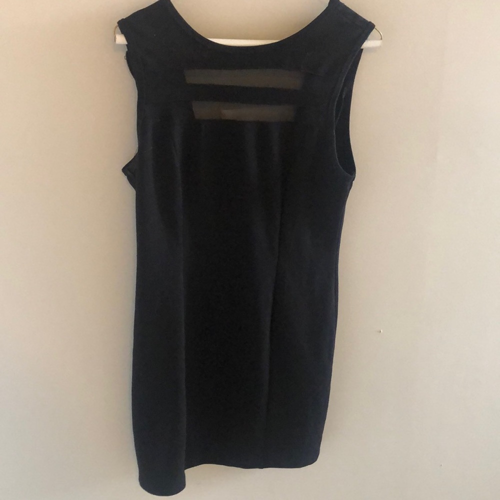 Women’s little black dress, snug fit and stretchy material. Size medium